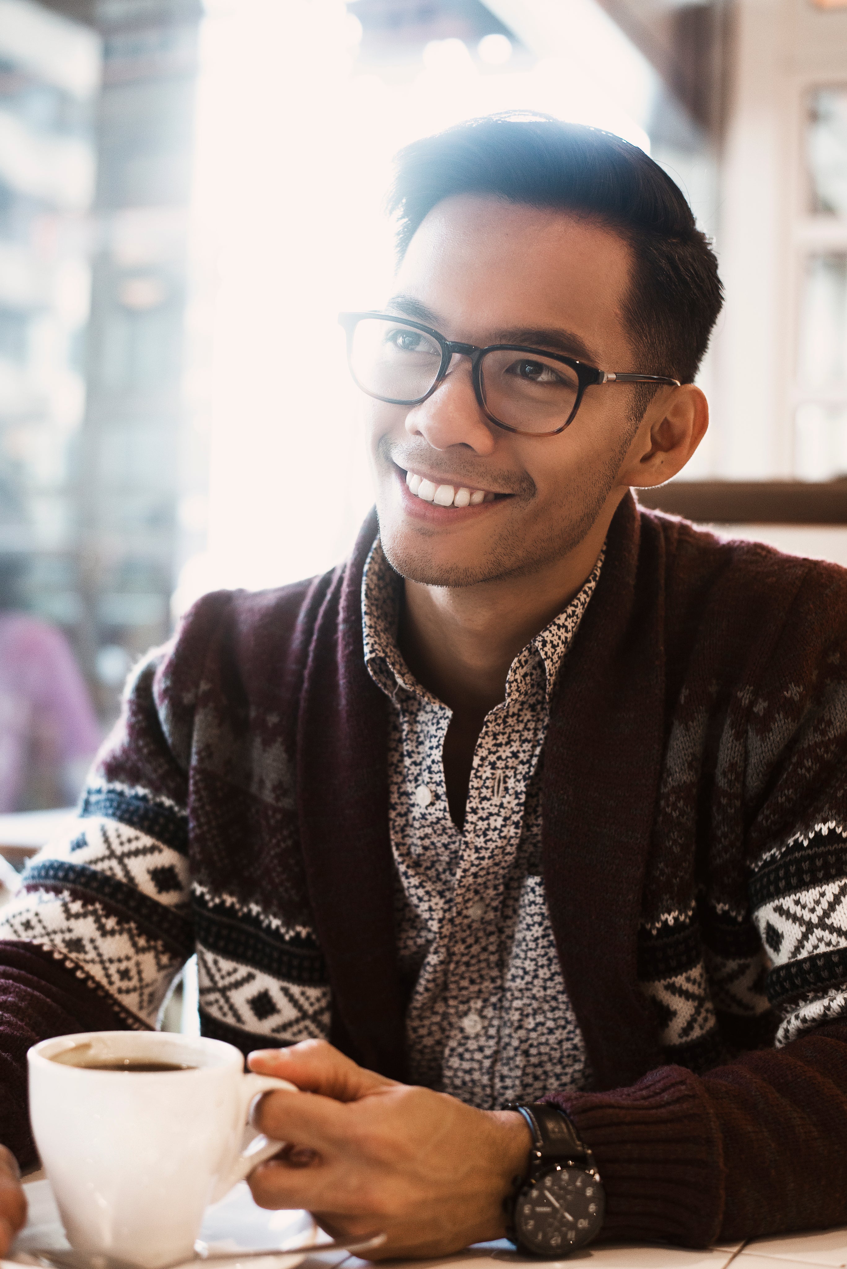 files/man-smiles-over-coffee-in-cafe.jpg